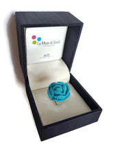 a bright and cute turquoise crocheted rose ring for her