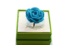 a resizable ring in a turquoise blue color