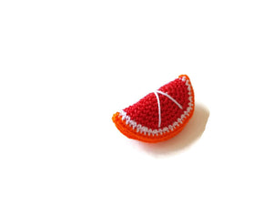 Red orange brooches