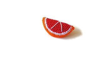 Red orange brooches