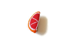 Red orange brooches