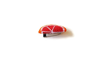 Red orange brooches