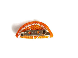 Orange brooch