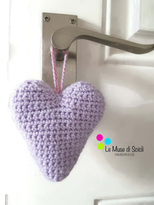 crocheted lilac heart hanging on a door bedroom decoration